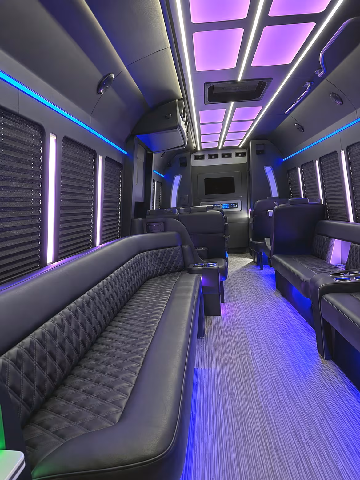 Friends laughing during a party bus celebration in Charlotte